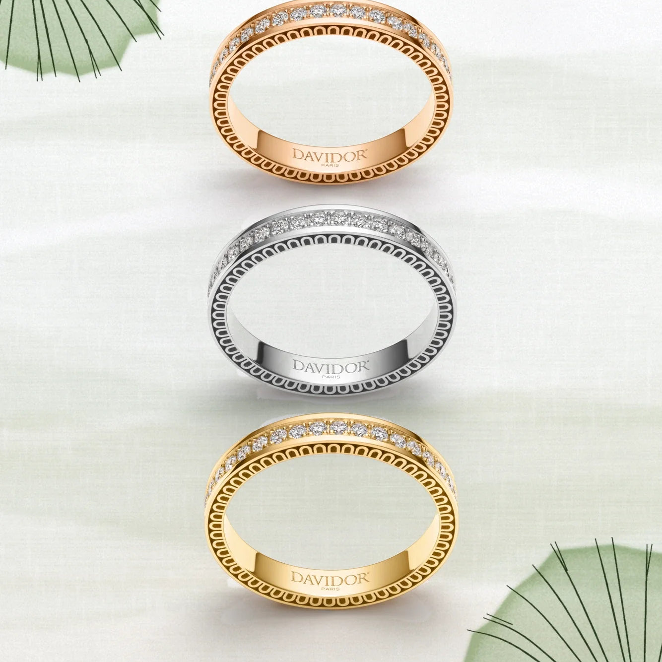 A thin silver bangle bracelet featuring a repeating arch design along its outer edge, displayed against a plain white background.