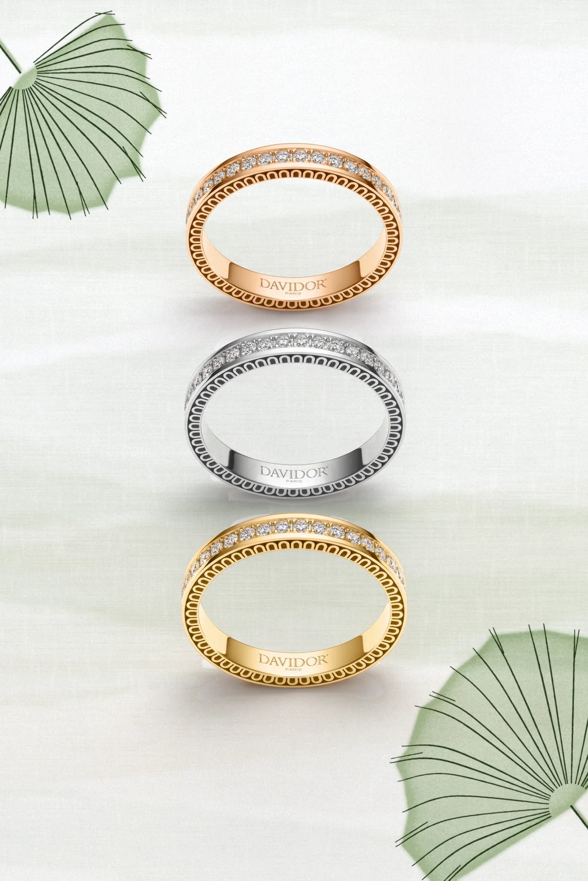 A thin silver bangle bracelet featuring a repeating arch design along its outer edge, displayed against a plain white background.