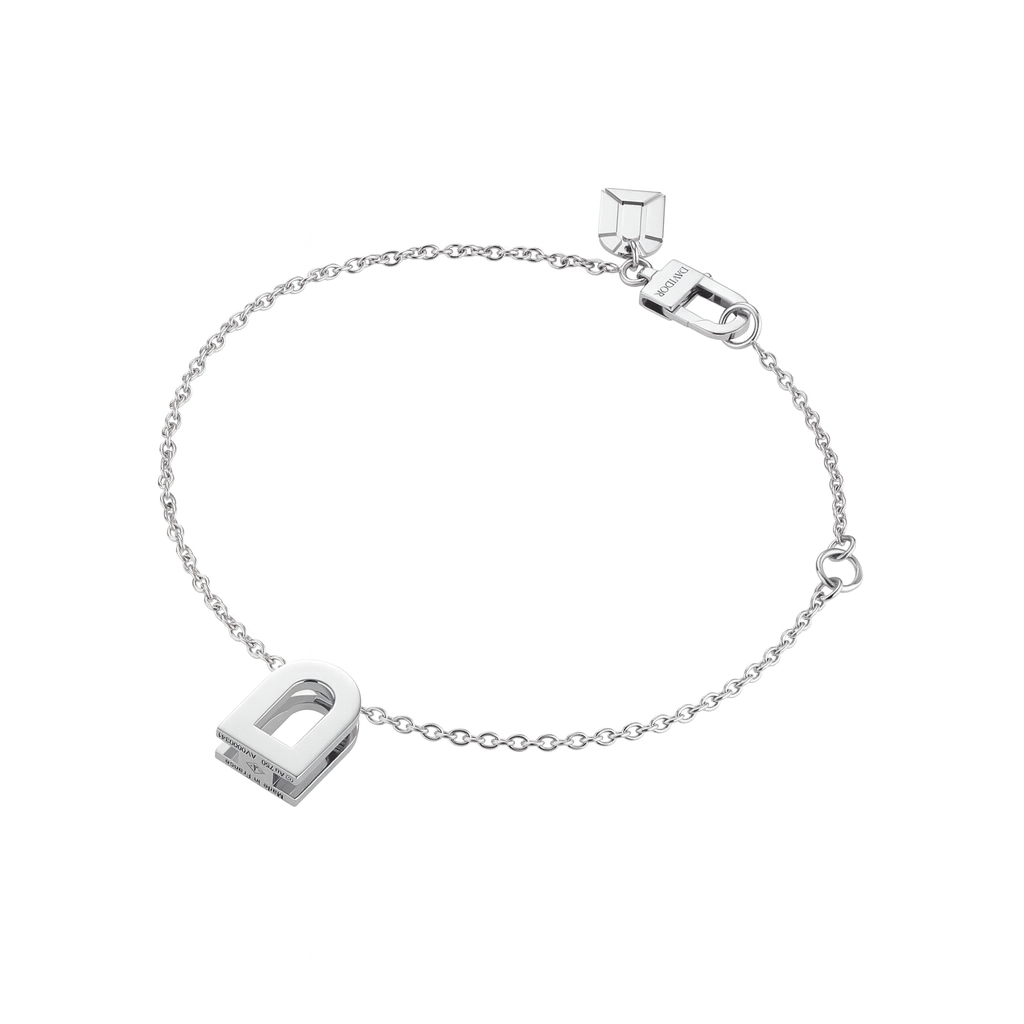 The L'Arc Voyage Charm PM is an 18k White Gold chain bracelet with a capital D charm and geometric accent near the clasp, adjustable, made in France, and beautifully displayed on a white background.