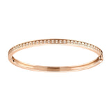 The L’Arc de DAVIDOR Bangle Mini, 18k Rose Gold with Satin Finish and Brilliant Diamonds, features a satin finish and a row of sparkling diamonds for elegant everyday wear.