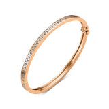 Introducing the L’Arc de DAVIDOR Bangle Mini, expertly crafted in 18k rose gold and adorned with lacquered ceramic. This elegant stackable bracelet features a repeating DAVIDOR Arch motif along the top edge, beautifully displayed on a white background, and brings timeless sophistication to any jewelry collection.