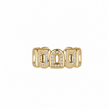 The Pop Arc Inverse Ring MM in 18k yellow gold features complete diamonds outlining repeating arches, set against a plain background—ideal for those who love 60s-inspired jewelry.
