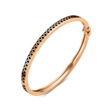 Introducing the L’Arc de DAVIDOR Bangle Mini, expertly crafted in 18k rose gold and adorned with a repeating black lacquered ceramic Arch pattern along the outer edge. Featuring a secure clasp closure, this stackable bracelet lends an elegant touch to any ensemble.