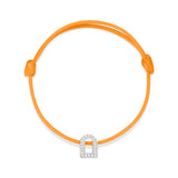 Introducing the L'Arc Voyage Charm PM bracelet, crafted from 18k white gold and embellished with sparkling Galerie diamonds. This elegant piece is set on a vibrant orange silk cord and originates from a prestigious Parisian atelier. It is beautifully displayed against a pristine white background.