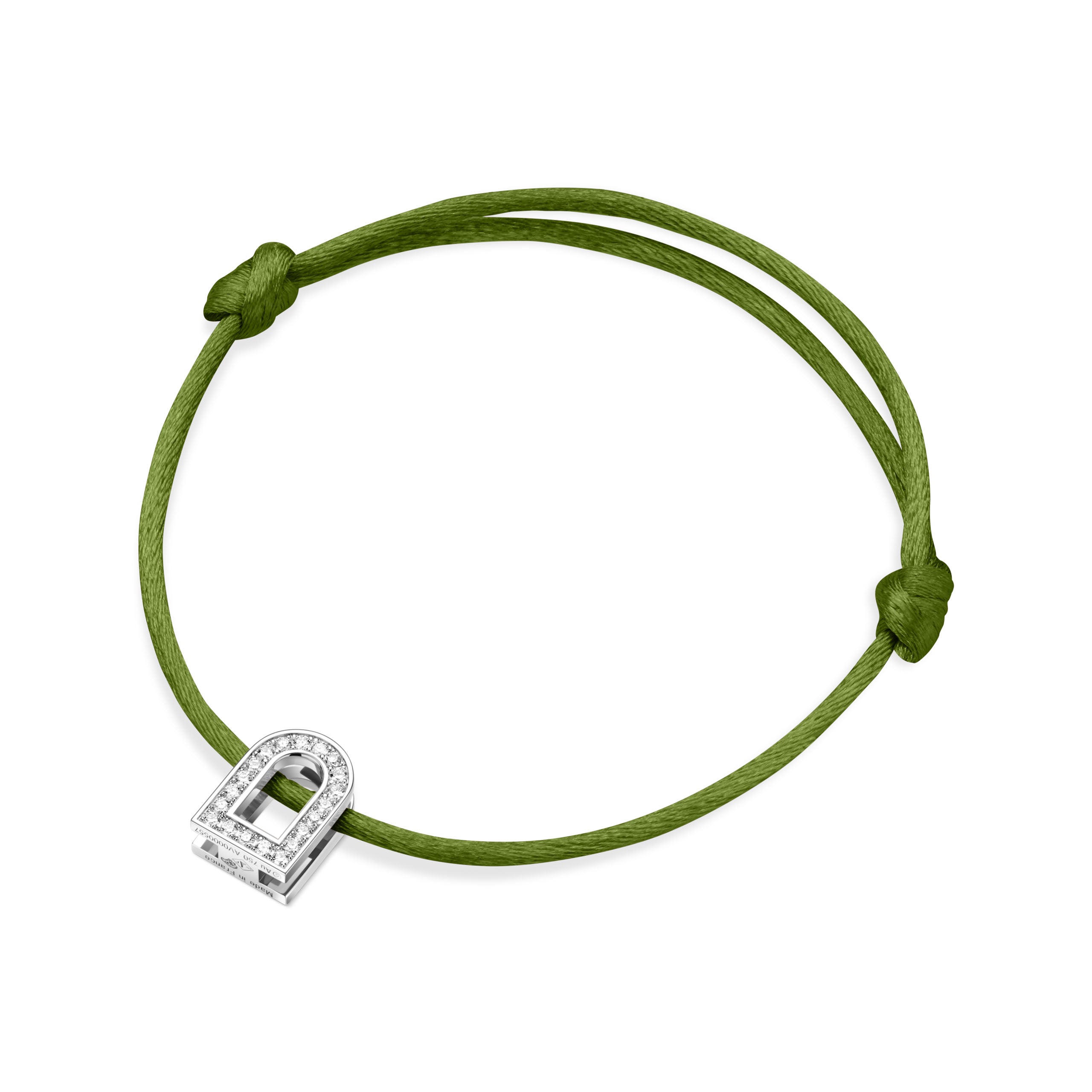 A silk cord bracelet in green, showcasing an adjustable knot design and featuring the L'Arc Voyage Charm PM from the Paris Atelier collection. The 18k white gold charm is embellished with Galerie diamonds and small clear stones resembling a silver padlock.