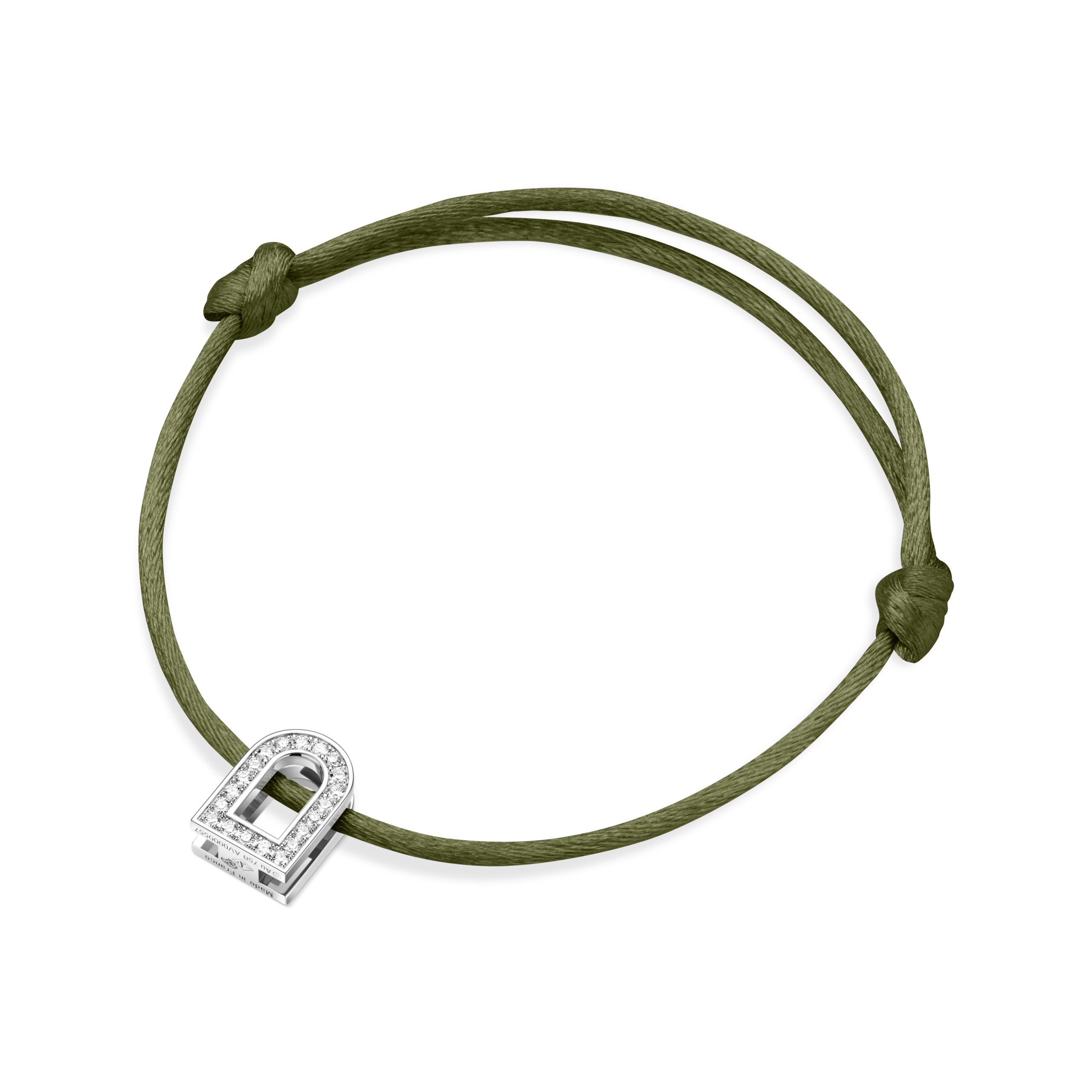 The L'Arc Voyage Charm PM is a silk cord bracelet in green, featuring an elegant 18k white gold lock-shaped charm adorned with Galerie diamonds. It is intricately crafted in the sophisticated Paris Atelier and secured with simple knots framing the charm.