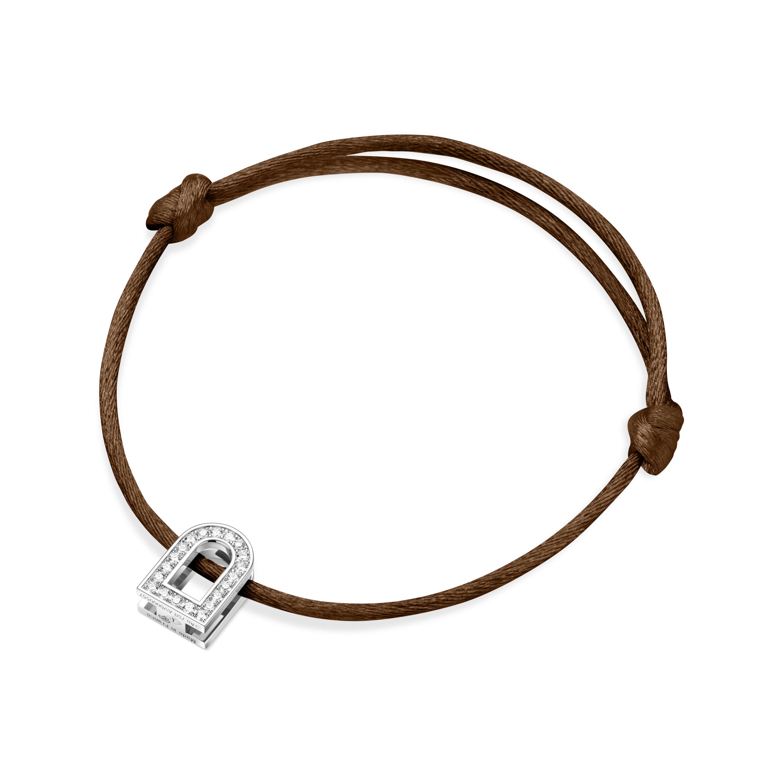 This understated brown silk cord bracelet, named the L'Arc Voyage Charm PM, is crafted from 18k white gold and displays a padlock charm embellished with Galerie diamonds, reflecting the elegance typical of a Paris Atelier design. The timeless padlock form brings sophistication to its minimalist allure, accentuated by touches of diamonds.