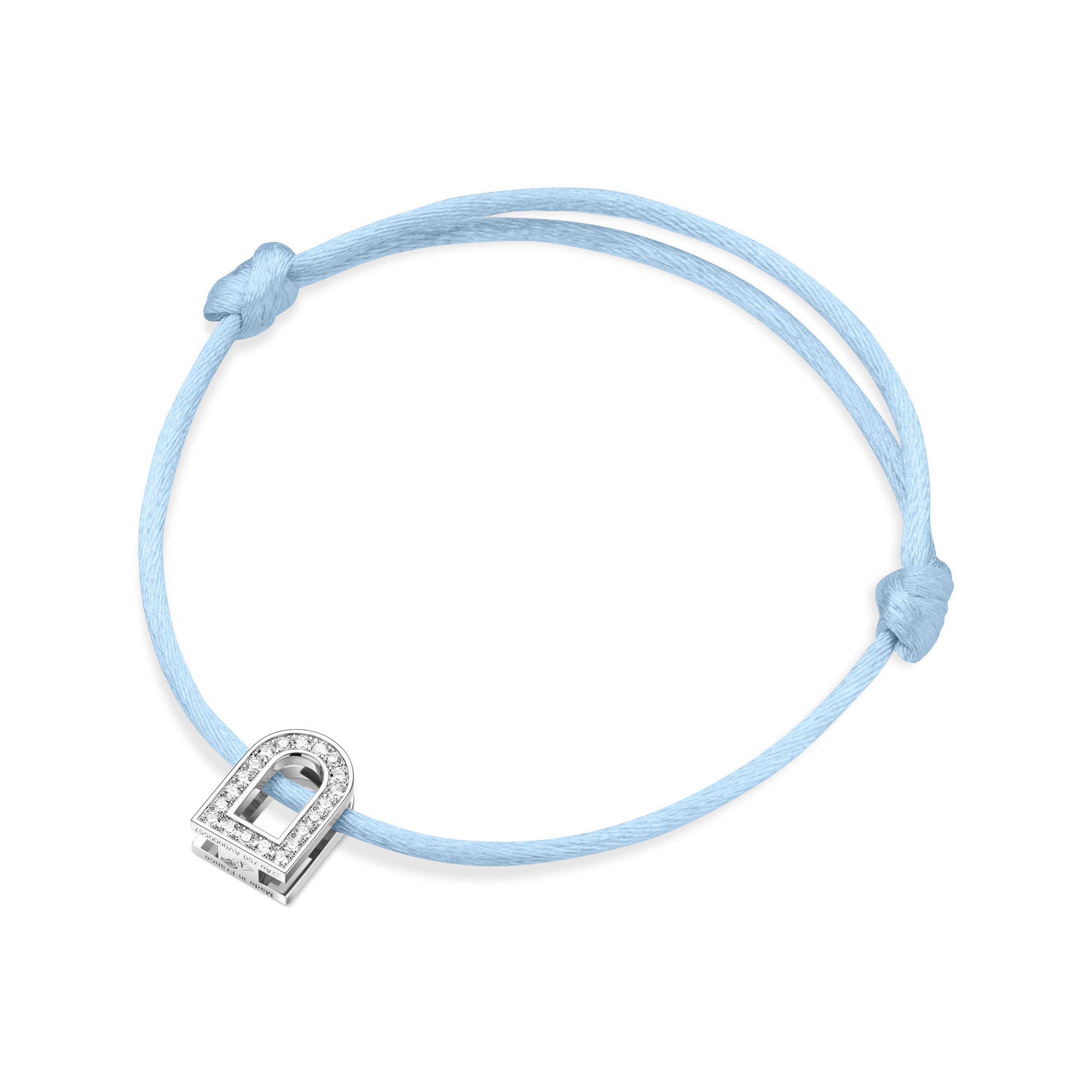 Introducing the L'Arc Voyage Charm PM, an elegant bracelet crafted by Paris Atelier. It features a light blue silk cord with adjustable knots and is adorned with a small, horseshoe-shaped charm made of 18k white gold. The charm sparkles with Galerie Diamonds, offering a look reminiscent of classic diamonds.