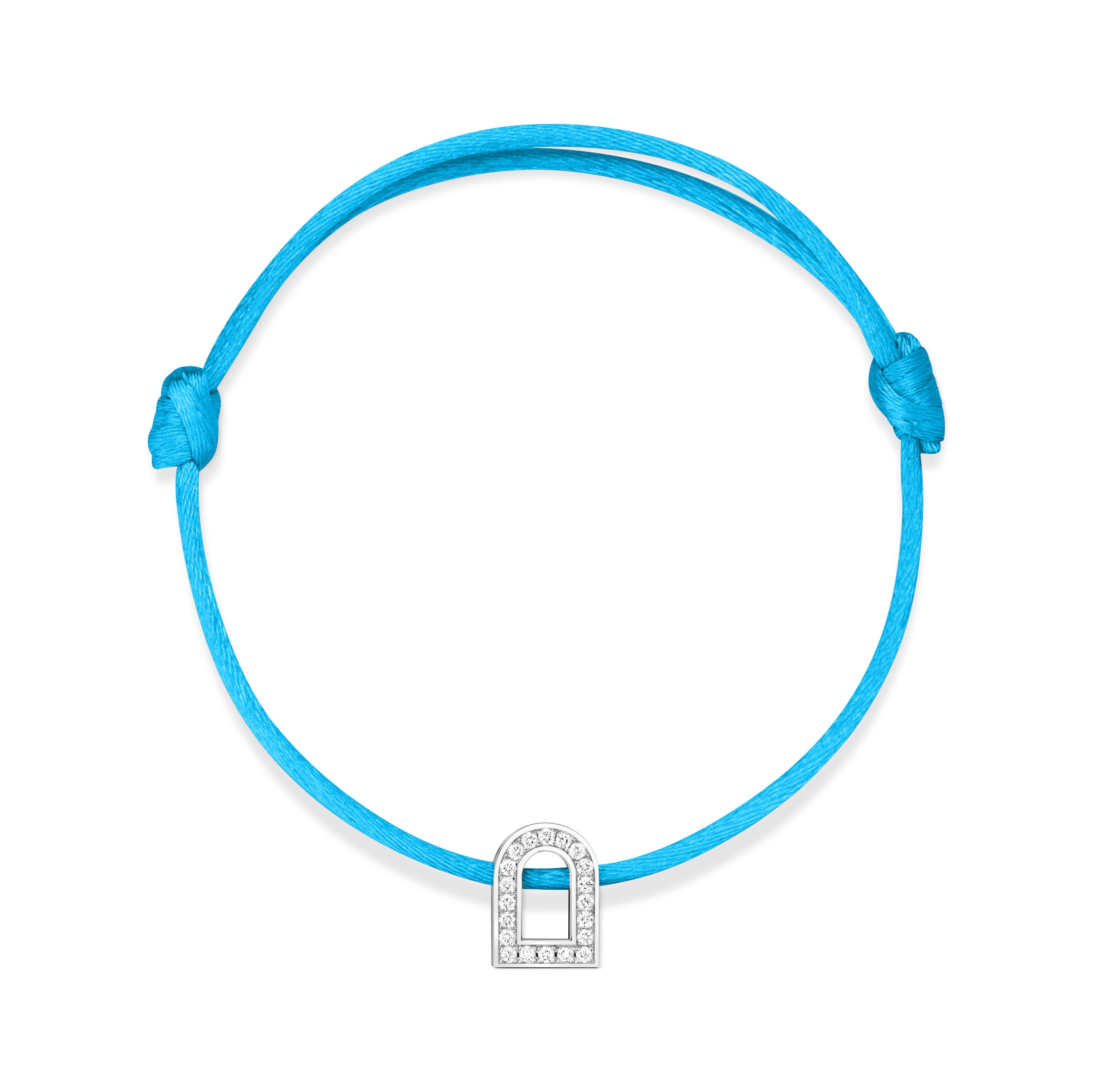 The L'Arc Voyage Charm PM bracelet features a turquoise silk cord with an adjustable knot and a white gold charm in a padlock design, adorned with Galerie diamonds. Crafted in a Paris Atelier, the charm is elegantly centered on the bracelet.