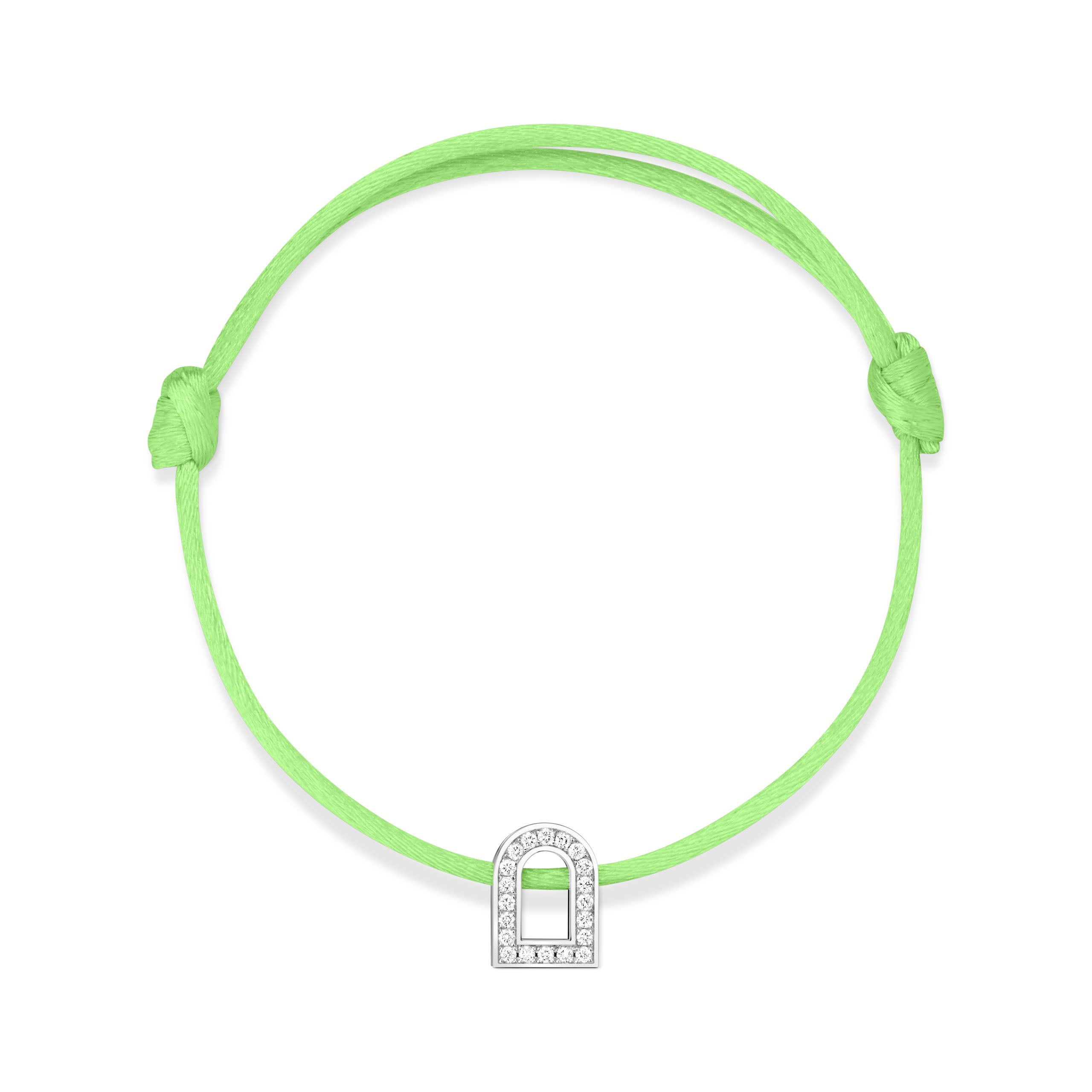 The L'Arc Voyage Charm PM bracelet from Paris Atelier features a neon green silk cord with an adjustable knot design and a silver charm shaped like a curved arch. This elegant piece, crafted in 18k white gold and embedded with Galerie diamonds, is beautifully displayed against a plain white background.